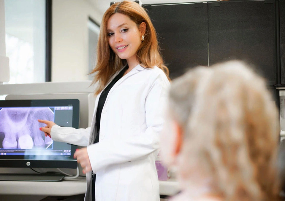 Dentist explaining dental treatment to patient in Torrance, CA